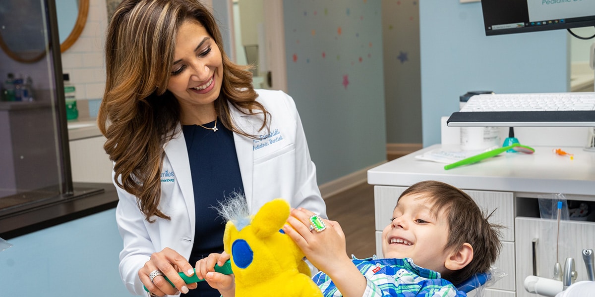 Dr. Jamshidi with son in dental chair